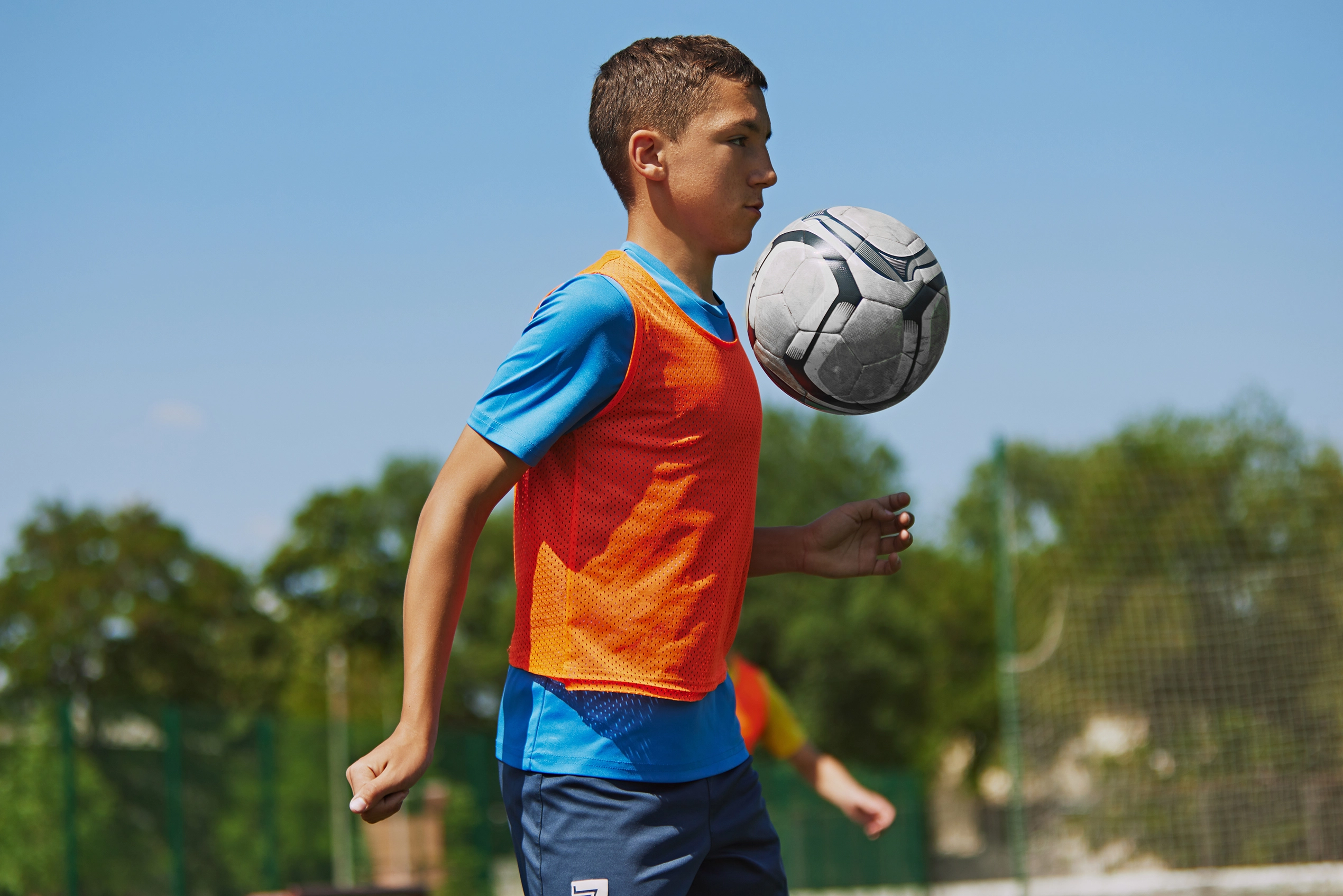 Young Teen Boy Soccer Player Chest Bump